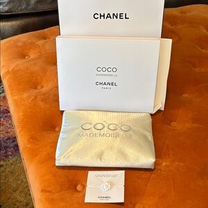 CHANEL Metallic Silver makeup Pouch with CHANEL flower bracelet